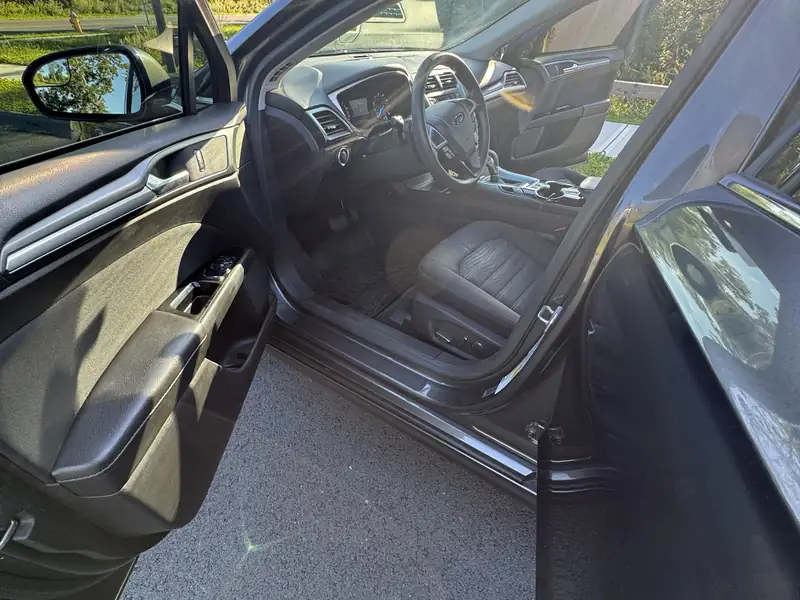 Ford Fusion: Driver's door open, front seats